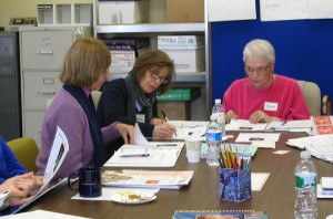 Familiarizing themselves with ULA's adult learning materials are (L-R) Sandy Perna, Jackie Schechter, and Rachel Pollan.