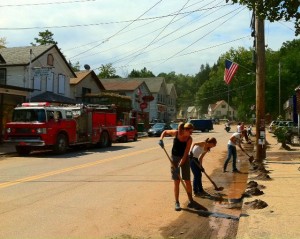Shandaken Phoenicia Rotary Civil Emergency Response Team Clean Up Volunteers shoveling river sand out of the streets of Phoenicia between storms Labor Day weekend to prevent sand from clogging drains. The sand was trucked to the highway department and recycled on icy winter roads.  