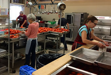 RVGA Farm to Food Pantry tomato processing at UC Community Action