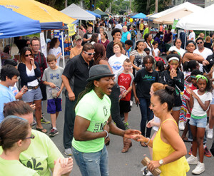 Bryant "Drew" Andrews, Director of ENERGY Dance Company, dancing with an attendee, at the 10th Annual Midtown Make a Difference Day Celebration, on Franklin Street, in Kingston, NY, on Saturday, June 20, 2015. Photo by Jim Peppler. Copyright Jim Peppler 2015.